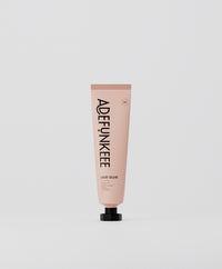 Lace Adhesive Glue in a pink tube